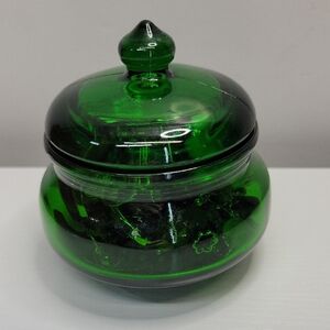 Green Glass Jar Filled With Earrings